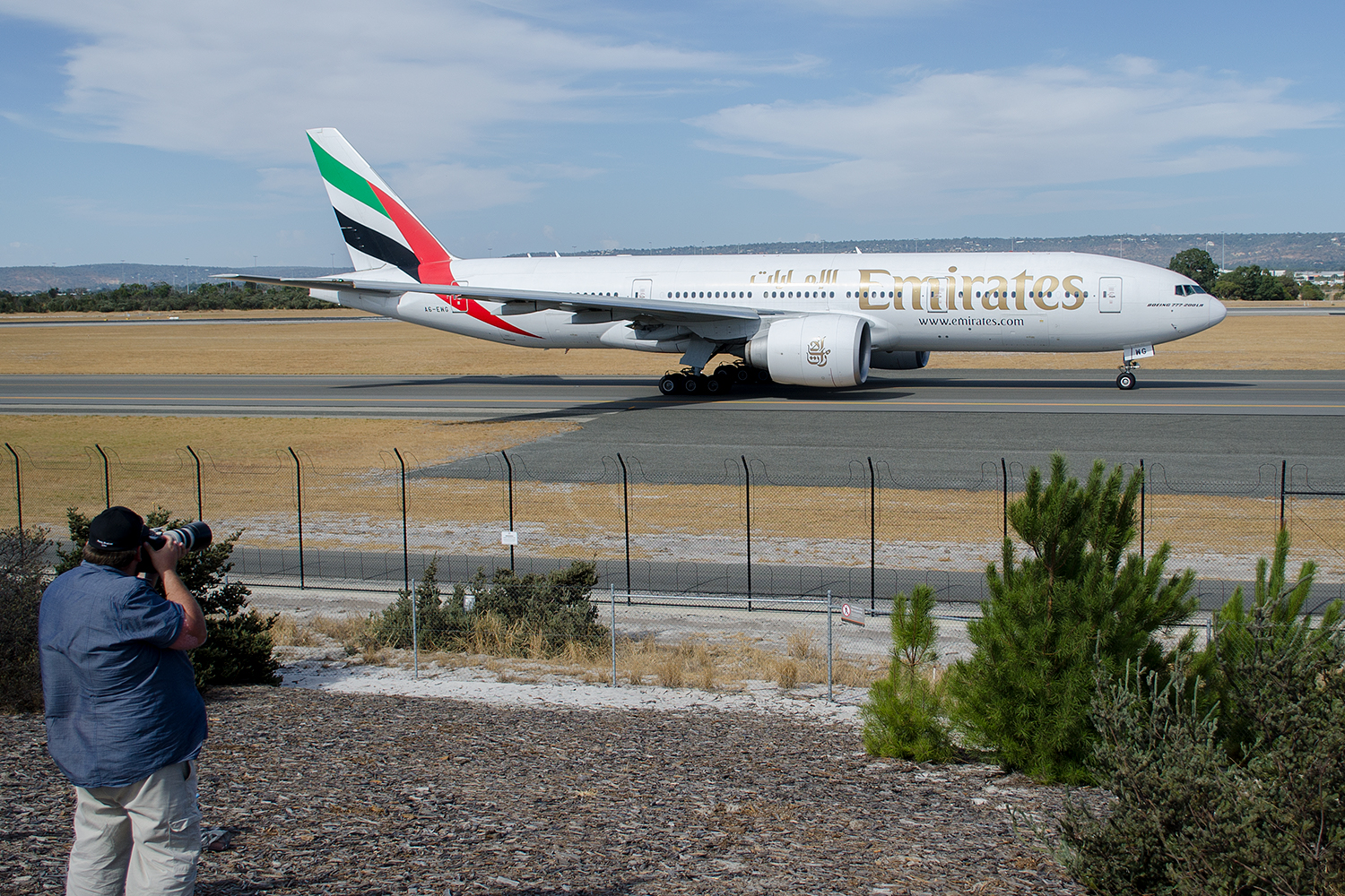 Departing aircraft pass by the viewing platform and everyone gets their shots