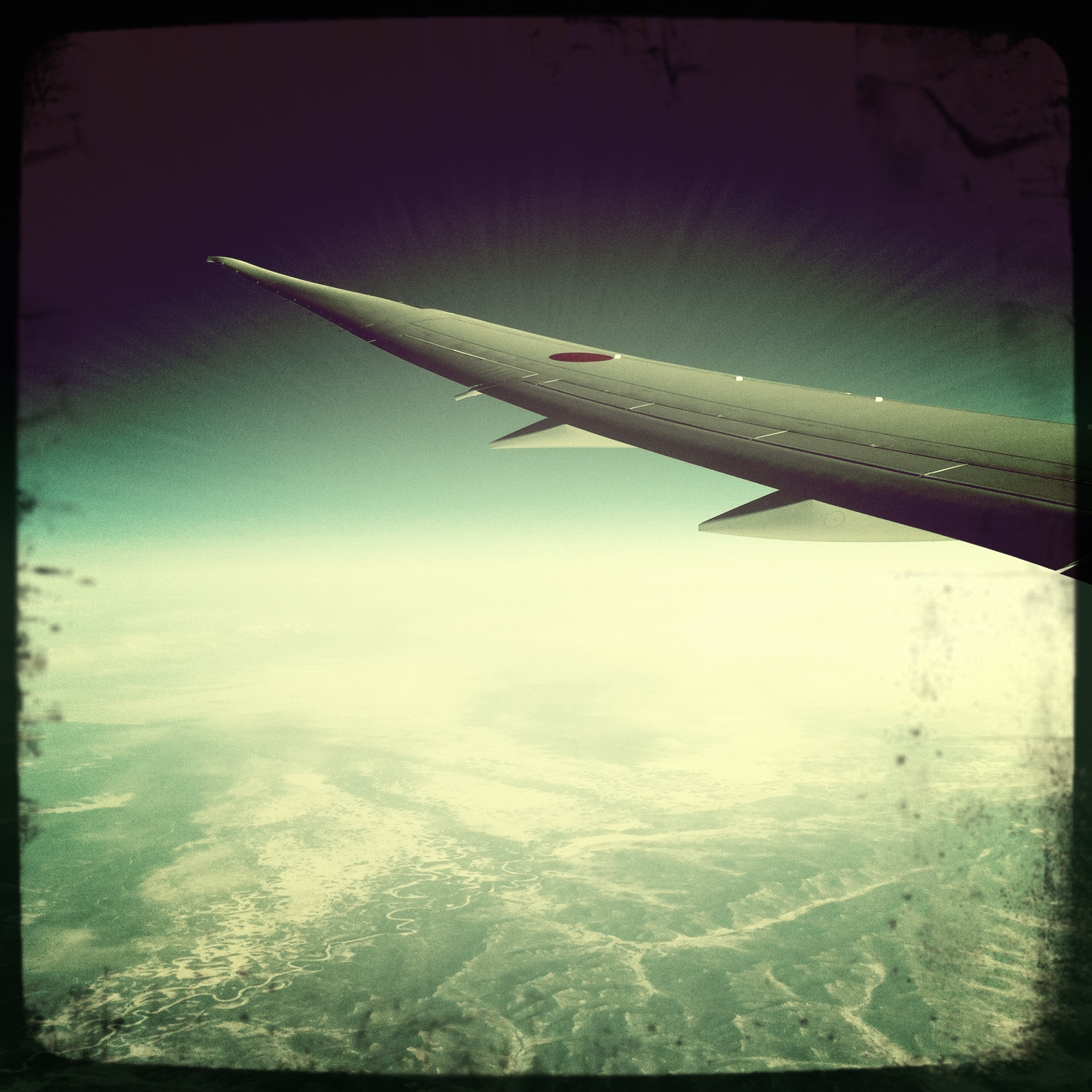 A Hipstamatic impression of 'Morning over Russia'...holy crap, that's Russia down there!